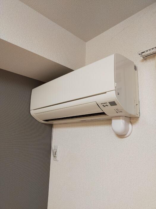 拡大写真：セジュール鵬州Ⅴ 1階103のエアコン