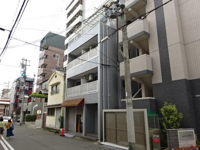 拡大写真:プチ・アムール 4階405の外観写真(昼)