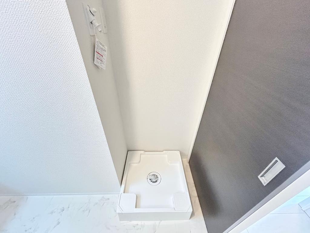 拡大写真:ピーコック 2階202の洗濯機置場