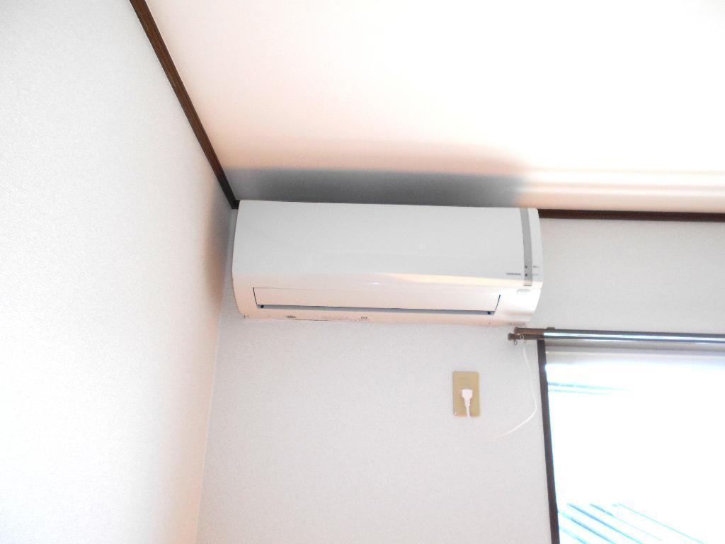 拡大写真:すまいるハイツ 2階202のエアコン