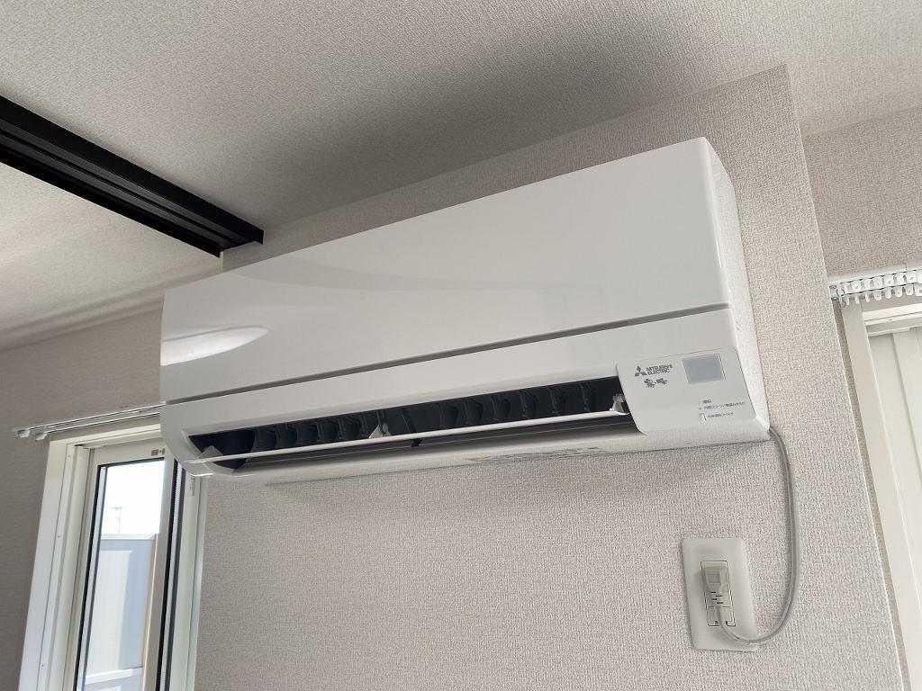 拡大写真:トリシア横町NORTH 2階205のエアコン