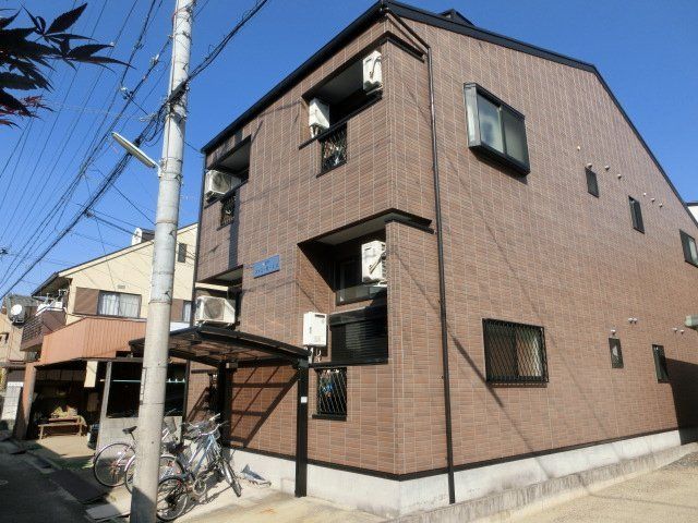 拡大写真：ファミール・エス 2階202の外観写真（昼）
