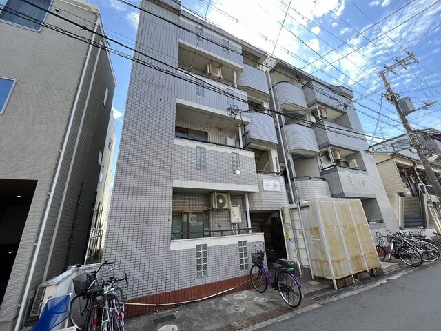 拡大写真:寝屋川市萱島東2丁目 1階101の外観写真(昼)