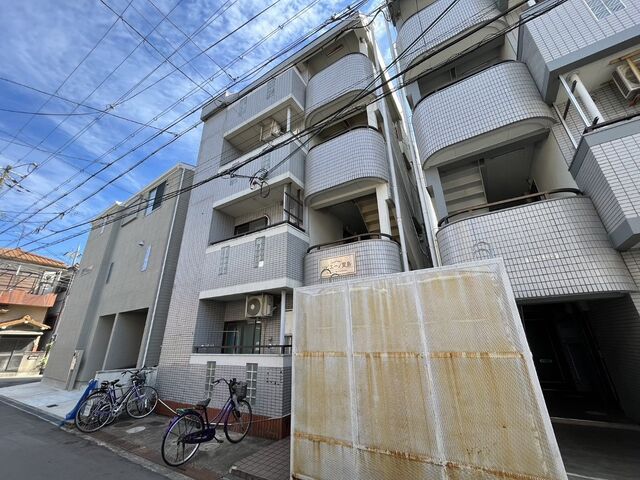 拡大写真:寝屋川市萱島東2丁目 1階101の外観写真(昼)