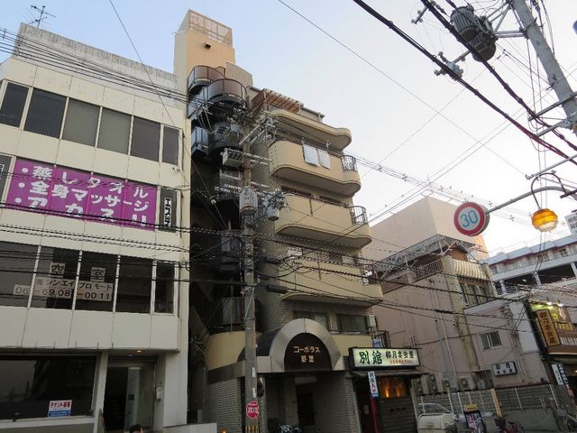 拡大写真：コーポラス野里 5階501の外観写真（昼）