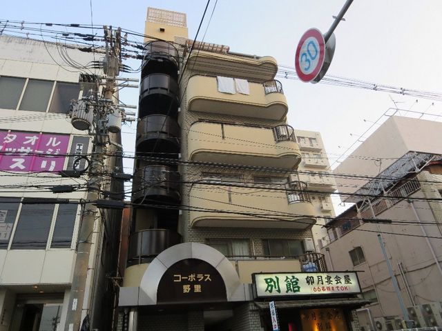拡大写真：コーポラス野里 5階501の外観写真（昼）