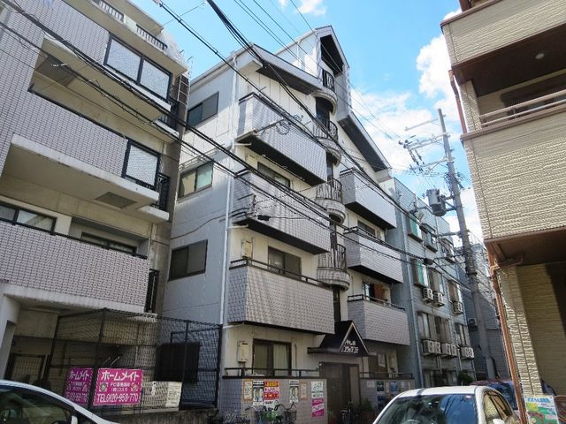 拡大写真：萱島サンヴィアンテ 2階201の外観写真（昼）