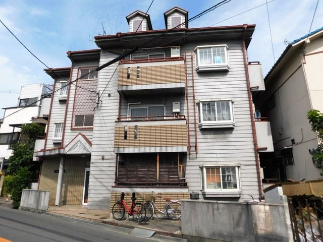 拡大写真：四條畷市南野４丁目 3階302の外観写真（昼）