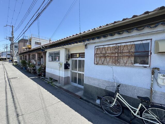 拡大写真:寝屋川市萱島東2丁目 1階1の外観写真(昼)