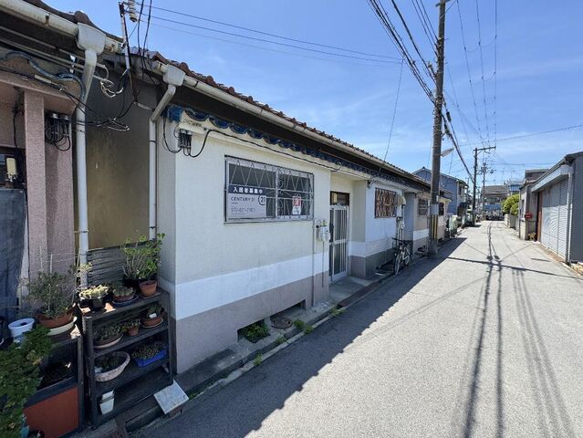 拡大写真:寝屋川市萱島東2丁目 1階1の外観写真(昼)
