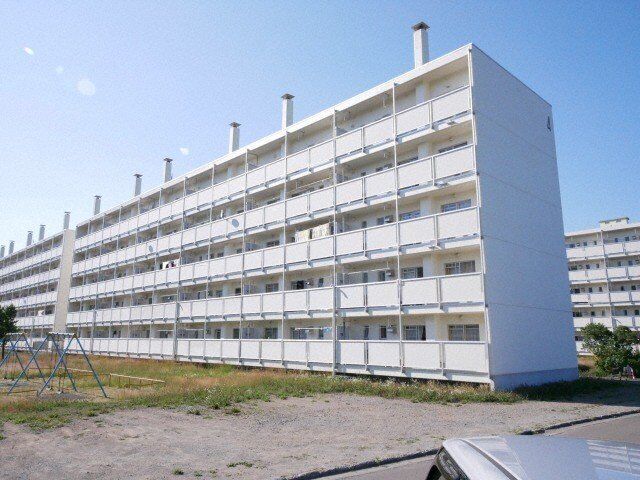 拡大写真：ビレッジハウス川沿 5階1-505の外観写真（昼）